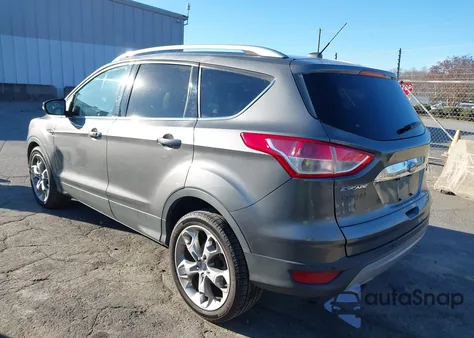 2014 Ford Escape Titanium z USA, uszkodzony, nr VIN 1FMCU0JX6EUC27993